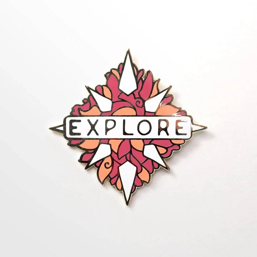 Explore enamel pin by Naomi VanDoren featuring a colorful adventure-themed design on a metal pin back.
