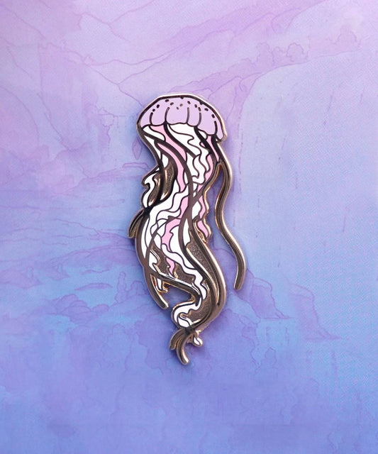 Colorful enamel pin of a jellyfish by Naomi VanDoren, featuring intricate details and a glossy finish.