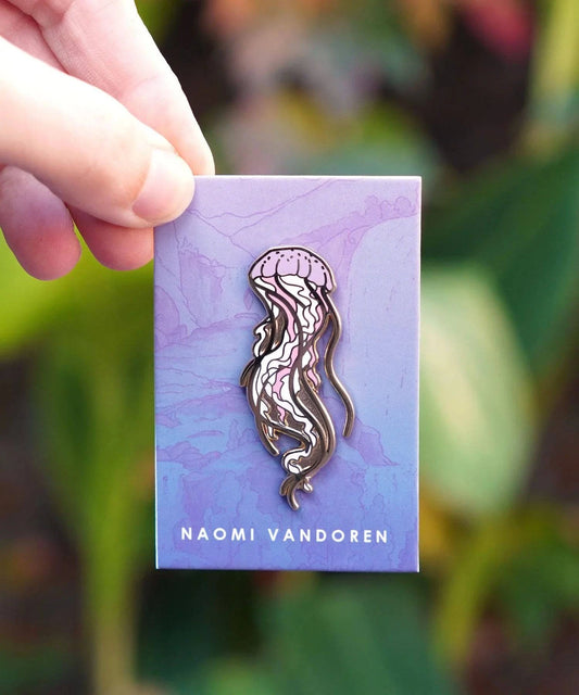 Colorful sea jelly enamel pin by Naomi VanDoren featuring a detailed jellyfish design for wearable ocean-inspired style.