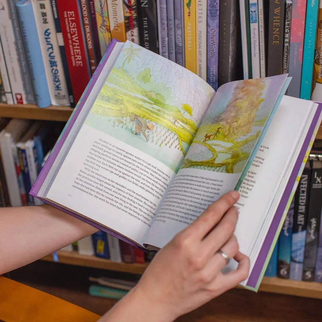 Illustrated novel "Naiya and the Foxdragon" by Naomi VanDoren displayed on a bookshelf, featuring colorful cover art and spine.