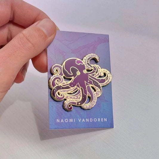 Purple octopus enamel pin by Naomi VanDoren, featuring detailed, colorful octopus design on a smooth metal backing.