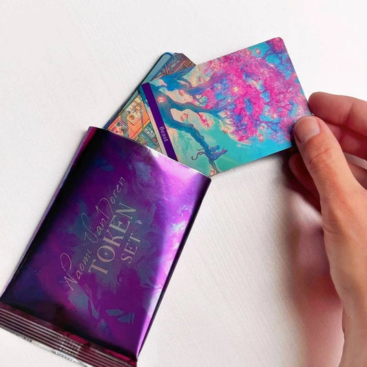 Token & Lands card decks by Naomi VanDoren featuring colorful artwork and adventure-themed illustrations.
