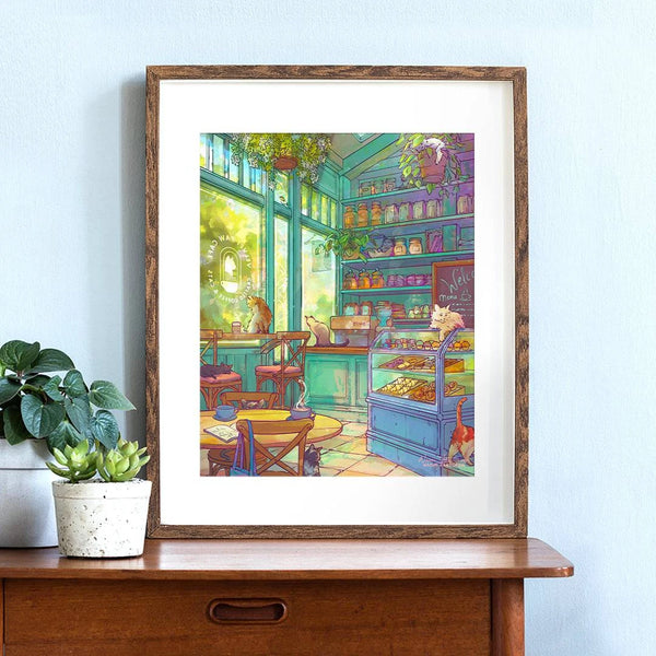 Framed art print of a cozy cat cafe scene by Naomi VanDoren, featuring cats relaxing inside a charming café setting.