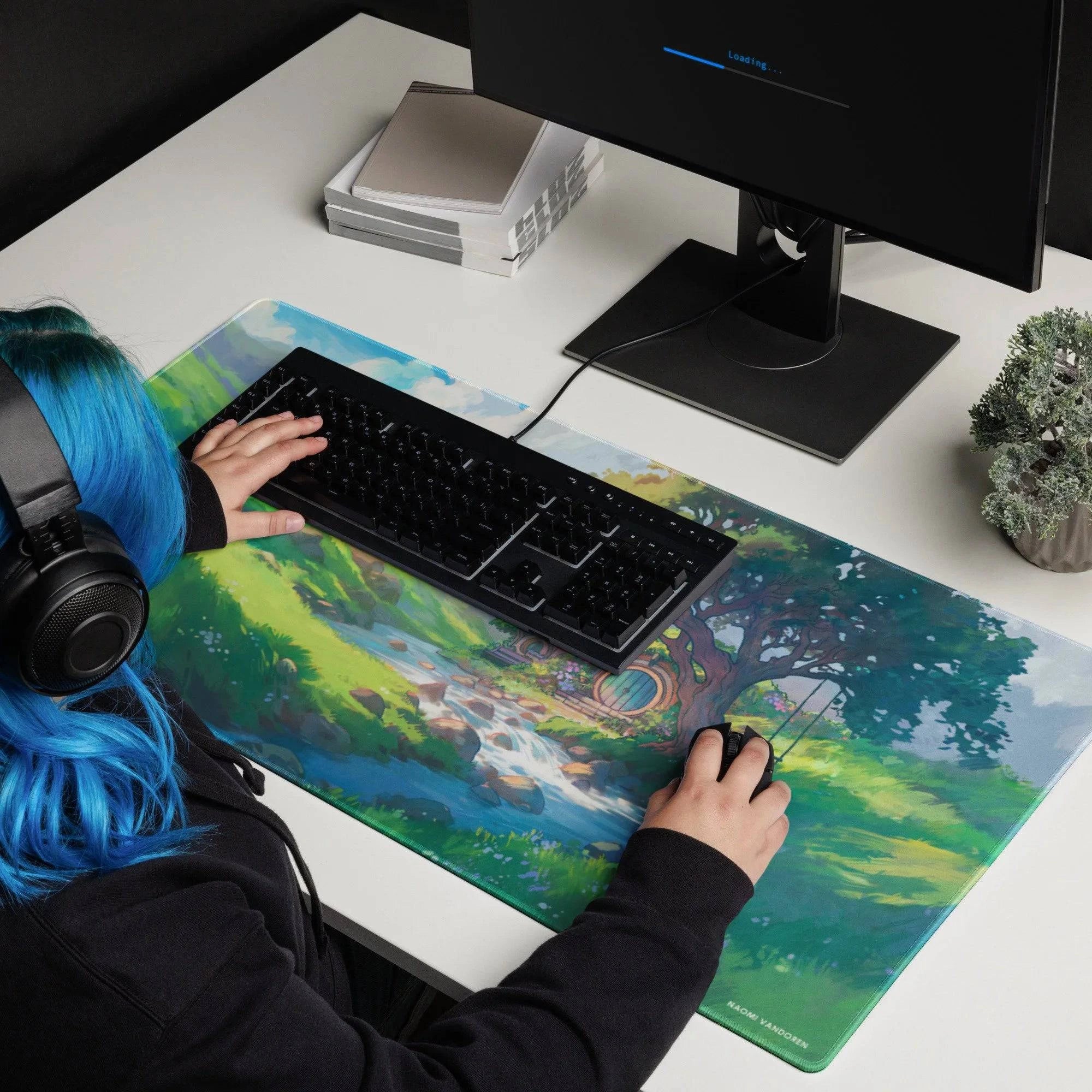 Large green Meadows desk and gaming playmat by Naomi VanDoren featuring Hobbit and adventure art, ideal for gaming and workspace.