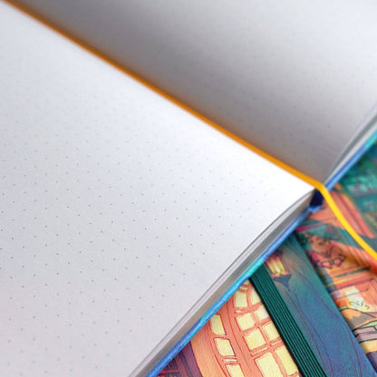 Grouped Naomi VanDoren Passage hardback notebooks with colorful cover art, ideal for writing and journaling.