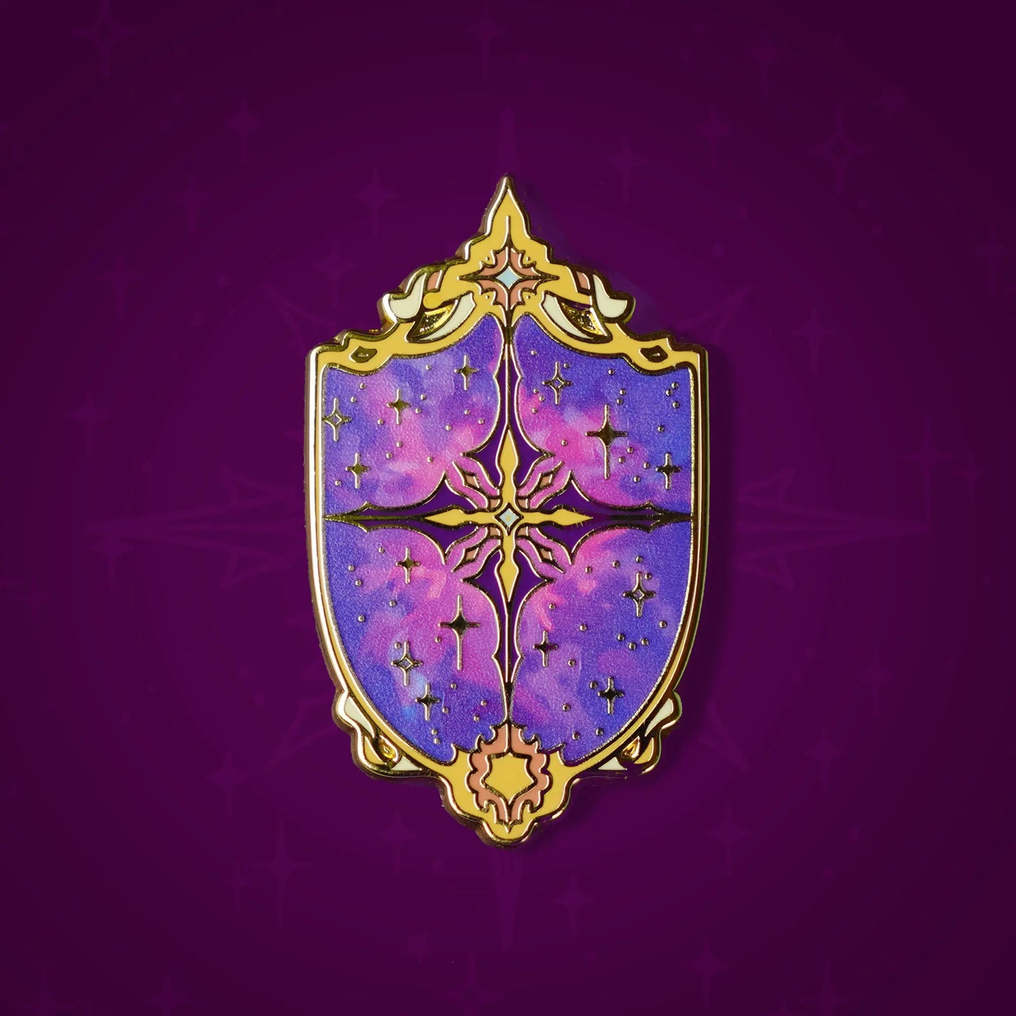 Celestial Armory Constellation Shield enamel pin by Naomi VanDoren featuring a starry shield design with cosmic details.