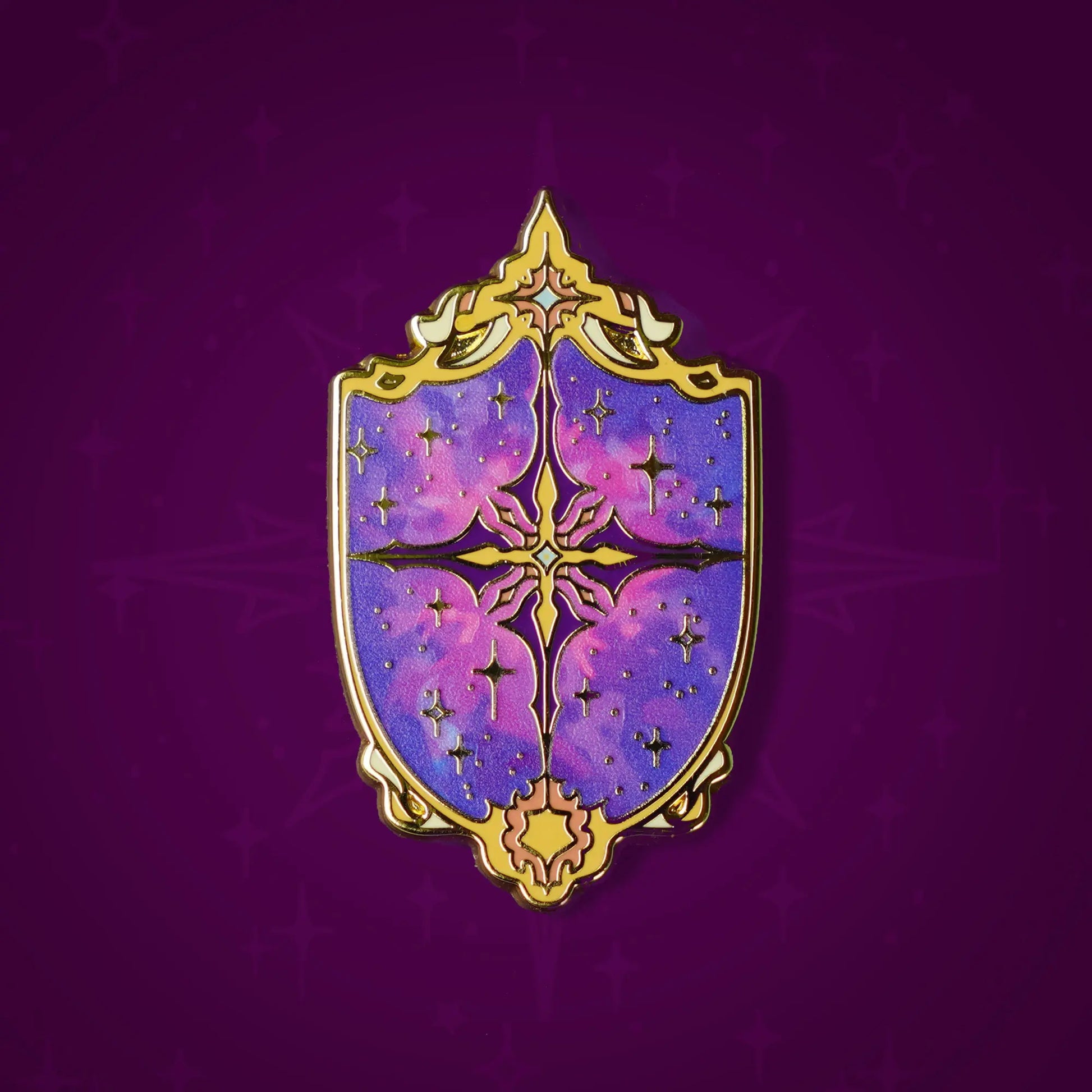 Celestial Armory Constellation Shield enamel pin by Naomi VanDoren featuring a starry shield design with cosmic details.